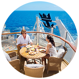 People enjoying a meal on deck